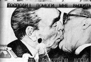 Russian leaders greeting with a presumably platonic kiss.